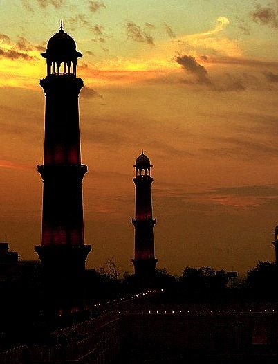 The minarets of Badshahi Masjid at dusk in Lahore, Pakistan